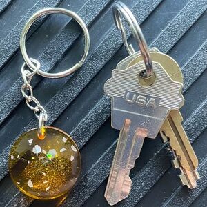 One-of-a-kind Honey-colored, Circular, Silver Glitter Resin Pendent Key Chain